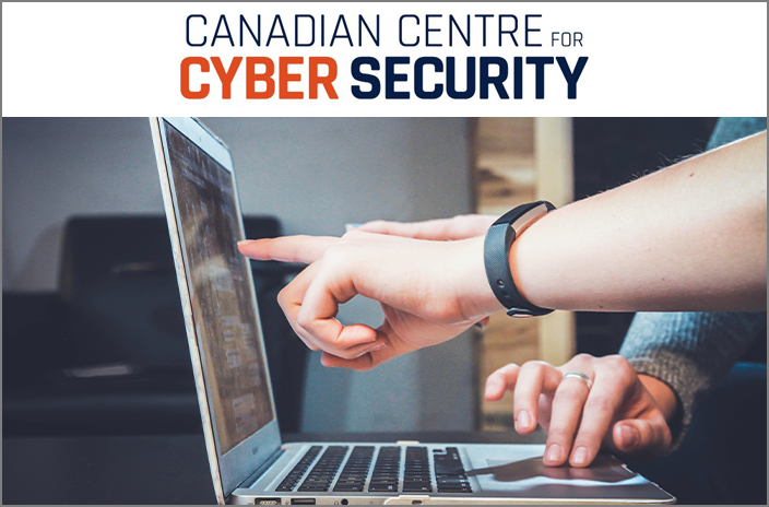 Hands pointing at laptop screen with words above: Canadian Centre for Cyber Security