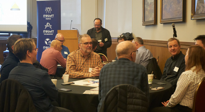 A group of staff engaging in a discussion.