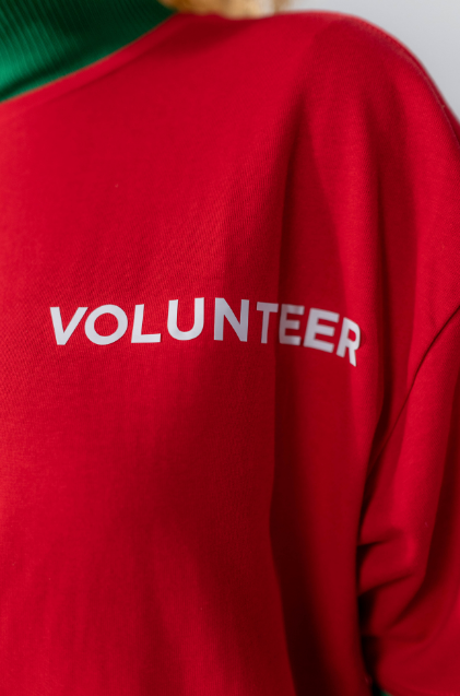 Red shirt with the word volunteer on it