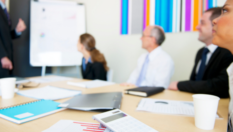 A group having a committee meeting.