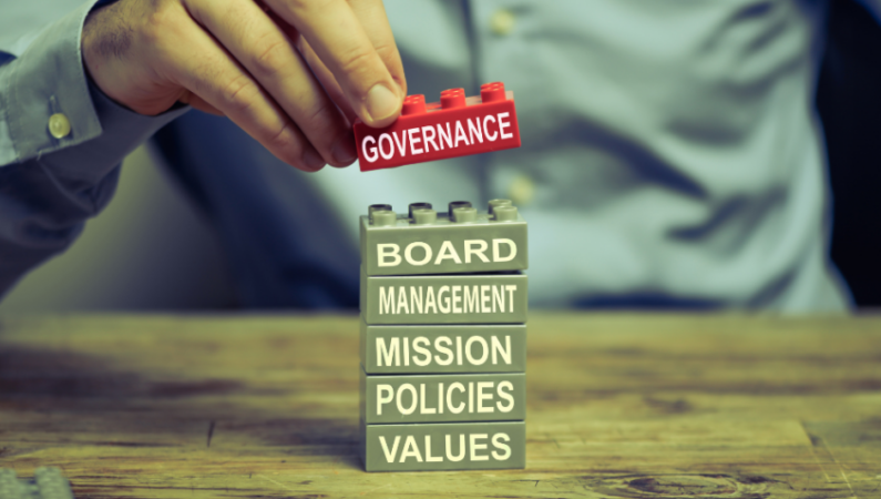 Building blocks labelled board, management, mission, policies and values with governance at the top.