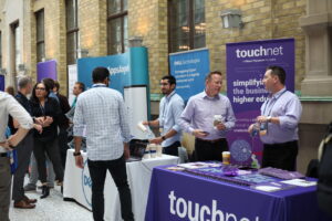 CANHEIT attendees browsing sponsor booths