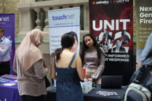 CANHEIT attendees browsing sponsor booths