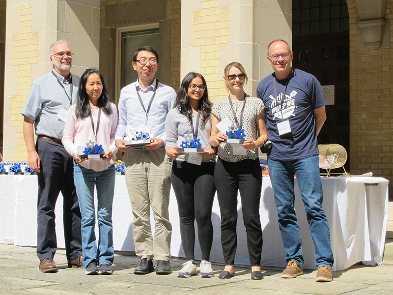 The EASI Rocket Shuttle Migration team receiving the OREP Impact Award