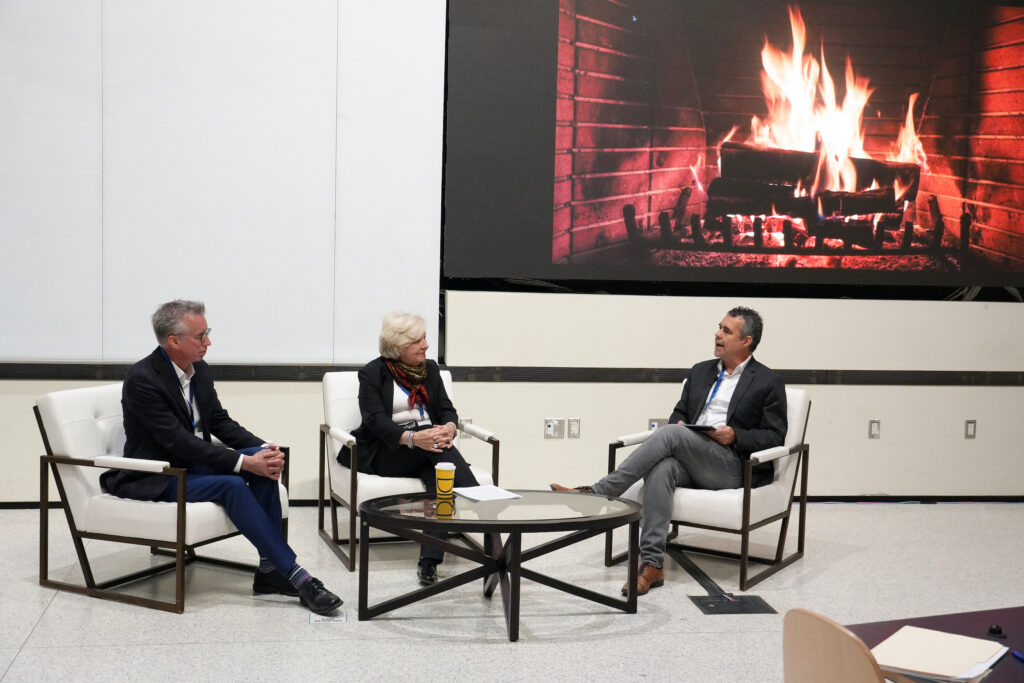 Deyves, Vickery and Steve talking on stage during the fireside chat