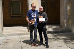 The secure cloud adoption with Azure landing zones and virtual WAN team receiving the Team Impact Award from Bo Wandschneider