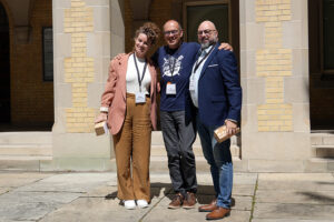 Vince Borghese and Esther MacAdam receiving the Team Impact Award from Bo Wandschneider