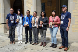 The DAI-IRSA team receiving the Team Impact Award from Bo Wandschneider