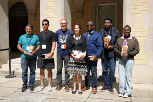 The SAT Foundations project team receiving the Team Impact Award from Bo Wandschneider