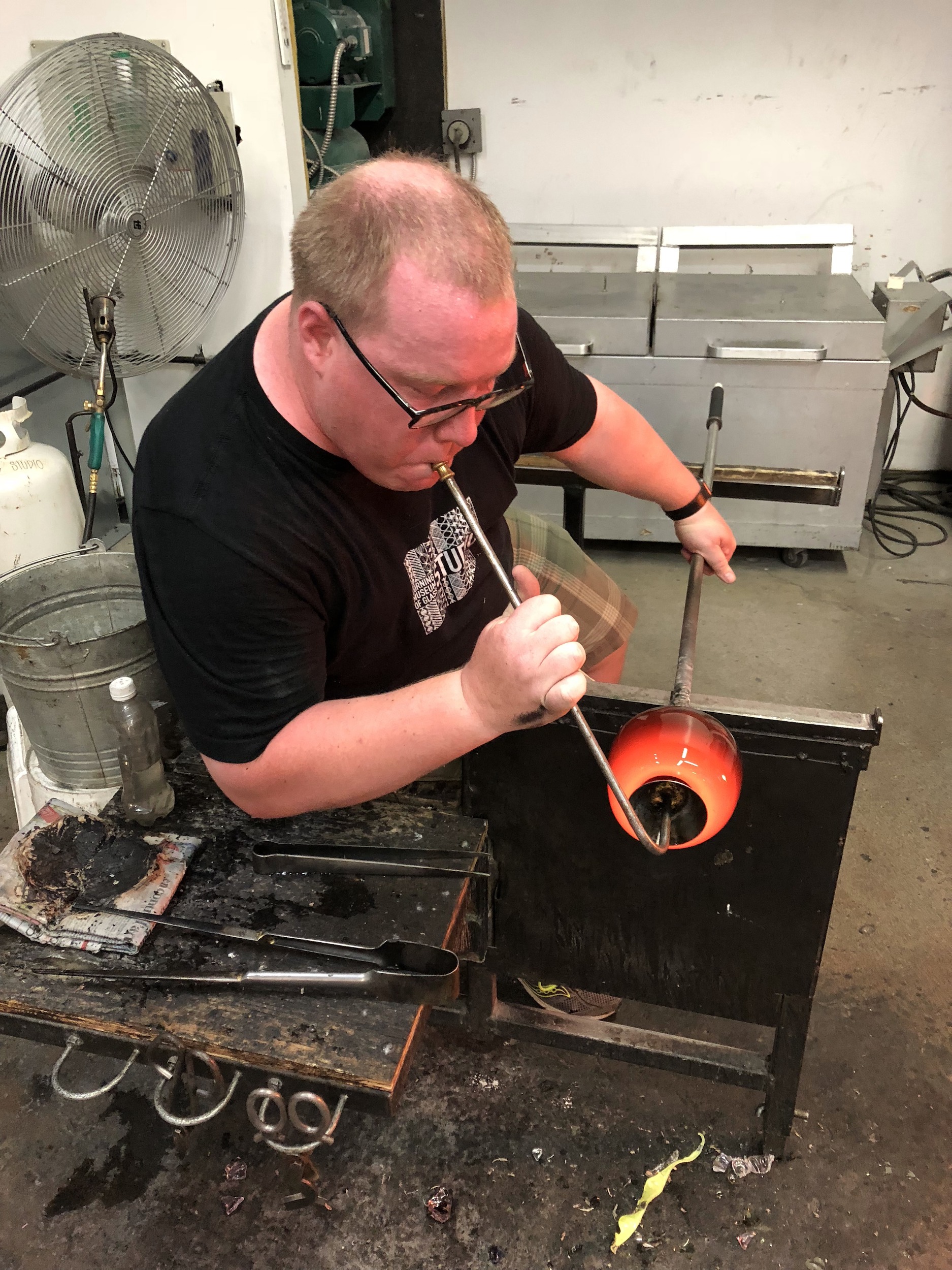 Paul blowing glass.