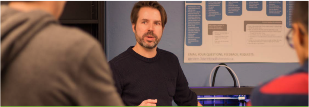 Photo of Mike Spears in colours speaking at a workshop.