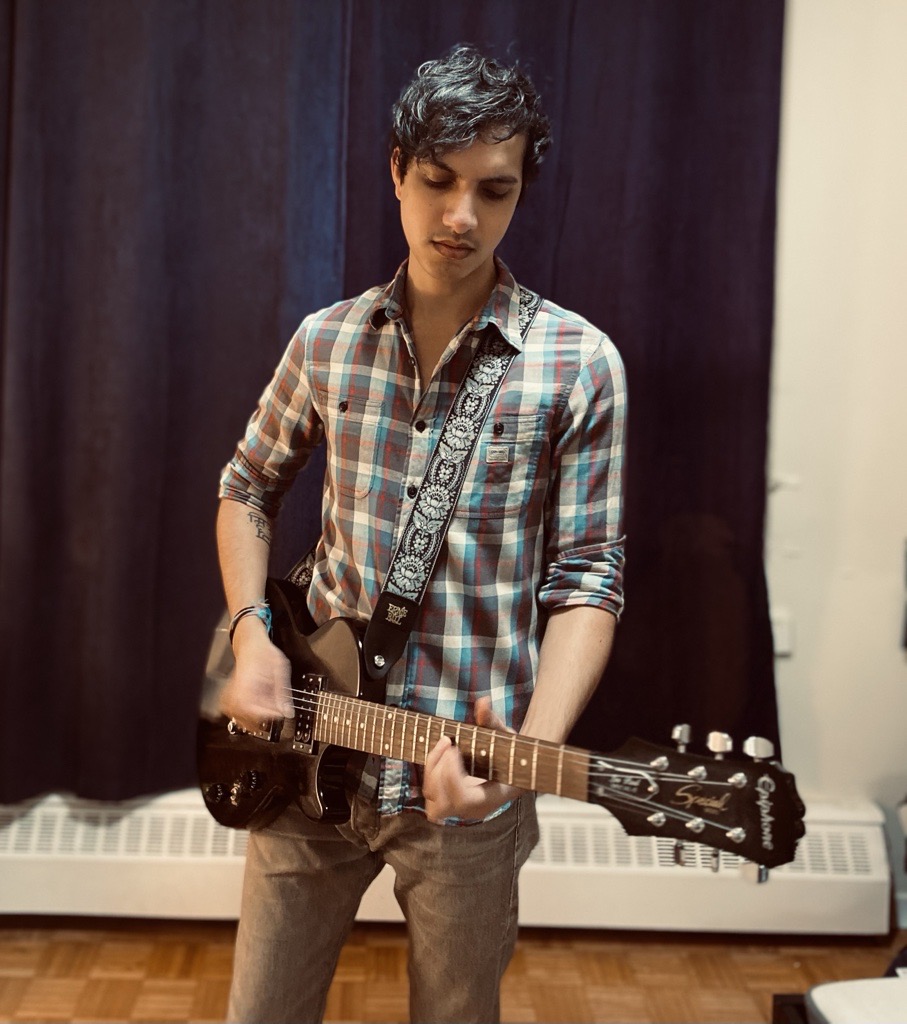 Keshav Raina playing a guitar.