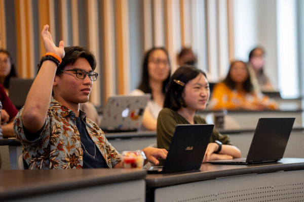 Student raised his hand during a lecture